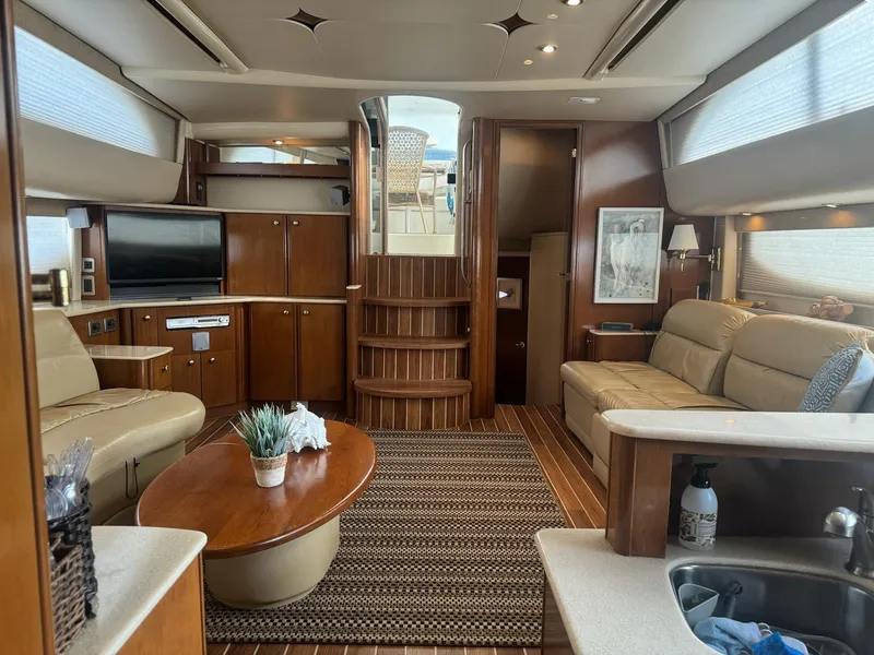 Slide: The Image of Luxurious interior of a 2005 Meridian 459 Motoryacht with elegant wood finishes and cozy seating. - 14