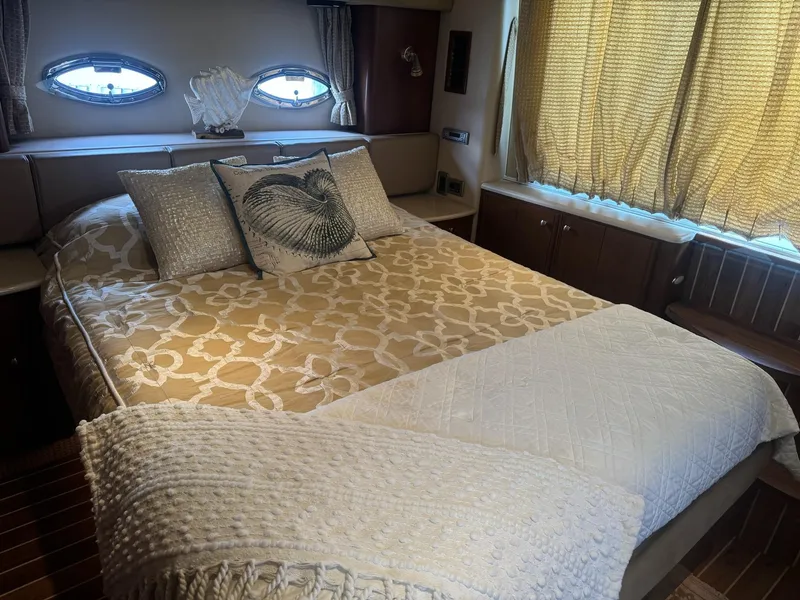 Slide: The Image of Luxurious bedroom in 2005 Meridian 459 Motoryacht with elegant bedding and natural light. - 17