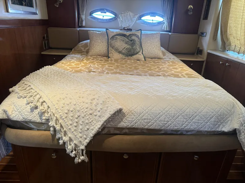 Slide: The Image of Luxurious bedroom interior of 2005 Meridian 459 Motoryacht with elegant bedding and decor. - 19