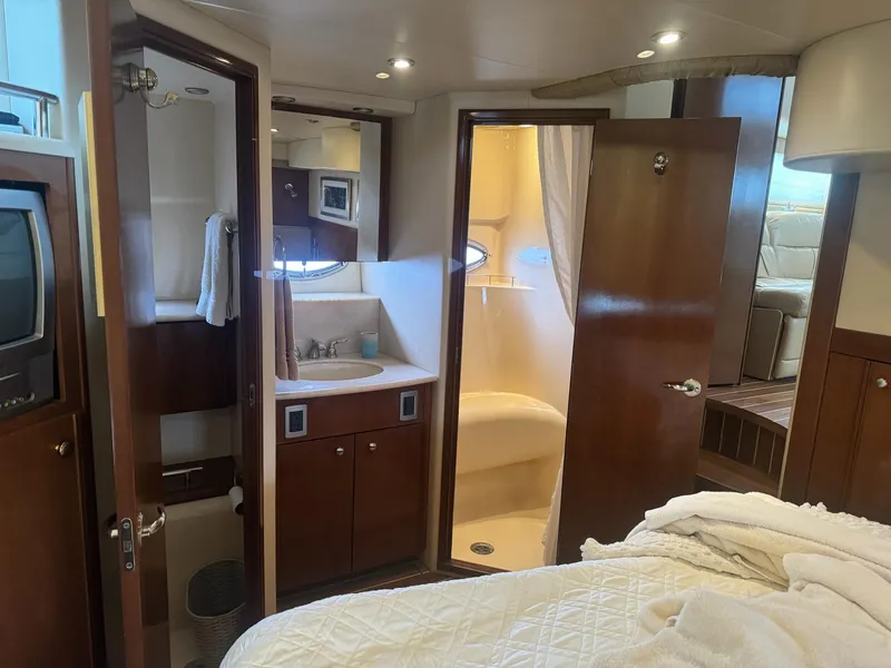 Slide: The Image of Luxurious 2005 Meridian 459 Motoryacht interior with bathroom and cozy bedroom. - 21