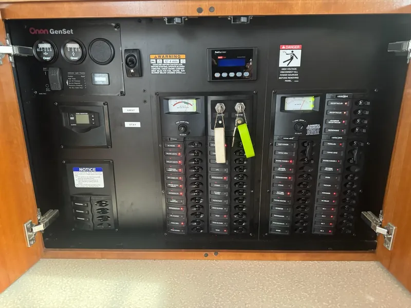 Slide: The Image of Electrical panel of a 2005 Meridian 459 Motoryacht with Onan GenSet controls. - 22