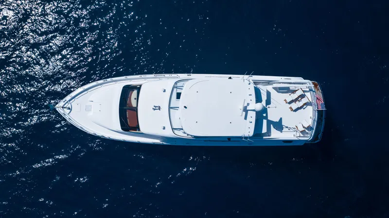 Slide: The Image of Aerial view of 2005 Hatteras 80 Motor Yacht on blue water. - 10