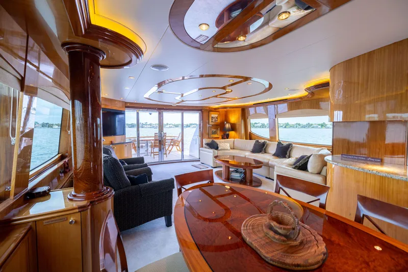 Slide: The Image of Luxurious interior of 2005 Hatteras 80 Motor Yacht with elegant wood finishes and spacious seating. - 19