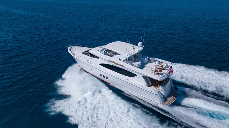 Slide: The Image of 2005 Hatteras 80 Motor Yacht cruising on open sea, aerial view. - 3