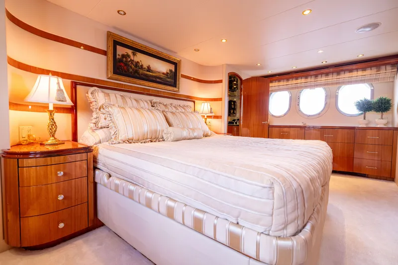 Slide: The Image of Luxurious bedroom interior of 2005 Hatteras 80 Motor Yacht with elegant decor and natural light. - 31