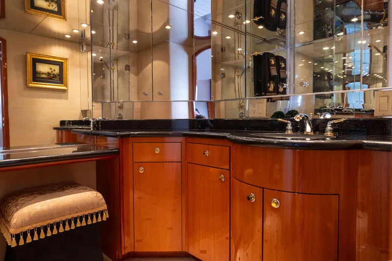 Slide: The Image of Luxurious bathroom interior of 2005 Hatteras 80 Motor Yacht with elegant wood cabinetry. - 33