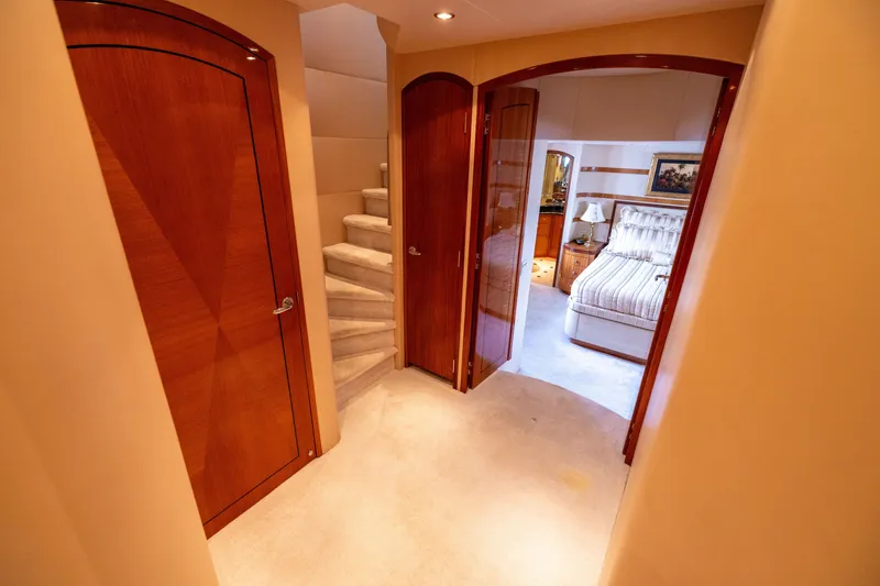 Slide: The Image of Interior of 2005 Hatteras 80 Motor Yacht with elegant wood doors and cozy bedroom. - 39