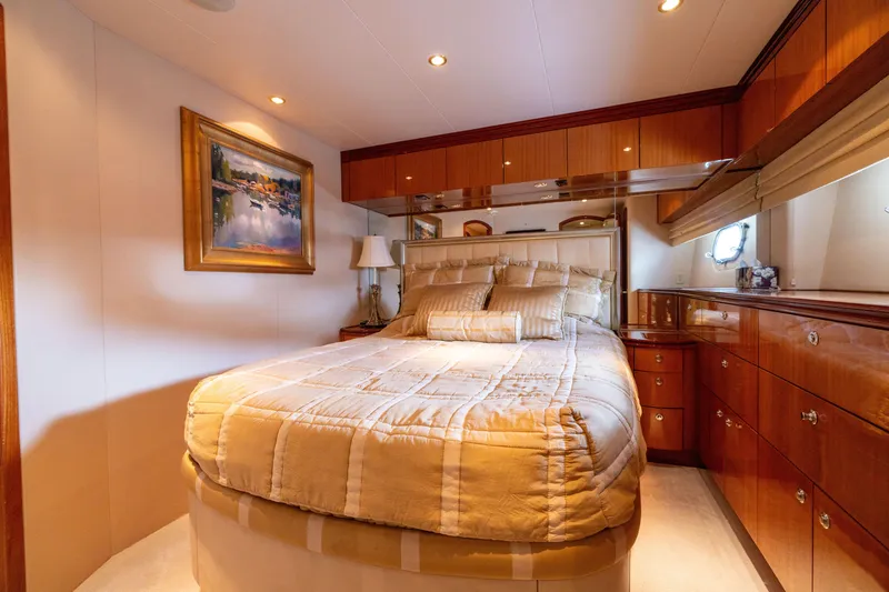 Slide: The Image of Luxurious bedroom interior of 2005 Hatteras 80 Motor Yacht with elegant wood finishes. - 46