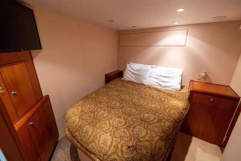 Slide: The Image of Cozy bedroom in 2005 Hatteras 80 Motor Yacht with elegant bedding and wooden cabinetry. - 49