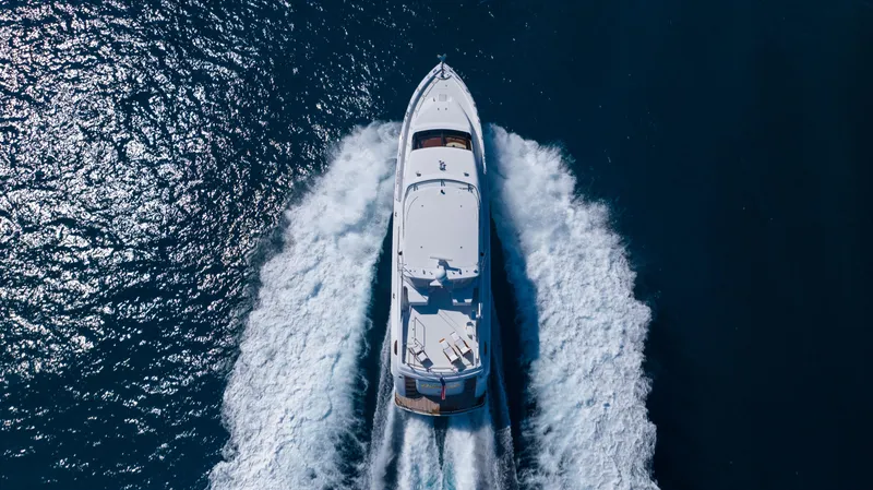 Slide: The Image of Aerial view of 2005 Hatteras 80 Motor Yacht cruising on open water. - 9