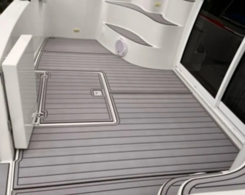Slide: The Image of 2004 Carver 360 Sport Sedan deck with sleek, modern design and gray flooring. - 26