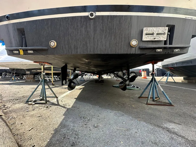 Slide: The Image of 1987 Ocean Yachts 48 Super Sport on stands, showing hull and propellers. - 16