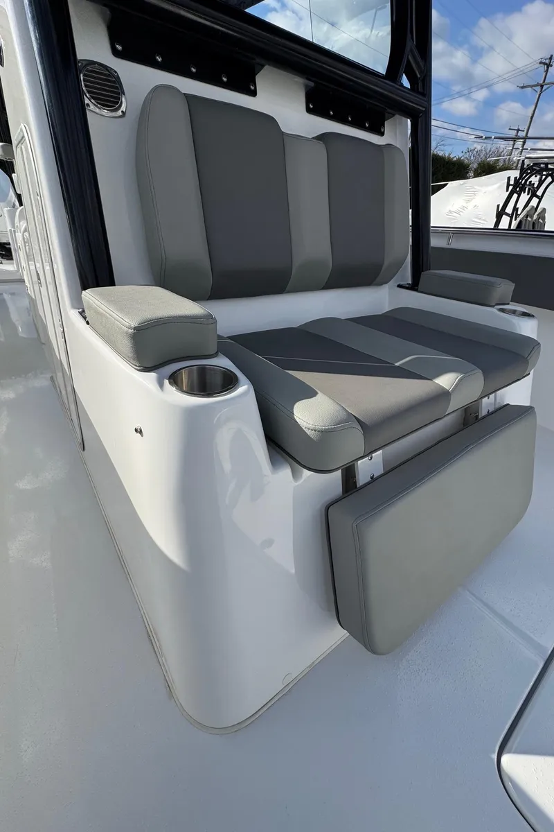 Slide: The Image of 2025 Cape Horn 36 XS boat seating with gray cushions and cup holder. - 11