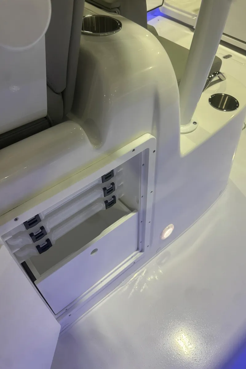 Slide: The Image of 2025 Cape Horn 36 XS boat interior with storage compartment and cup holders. - 15