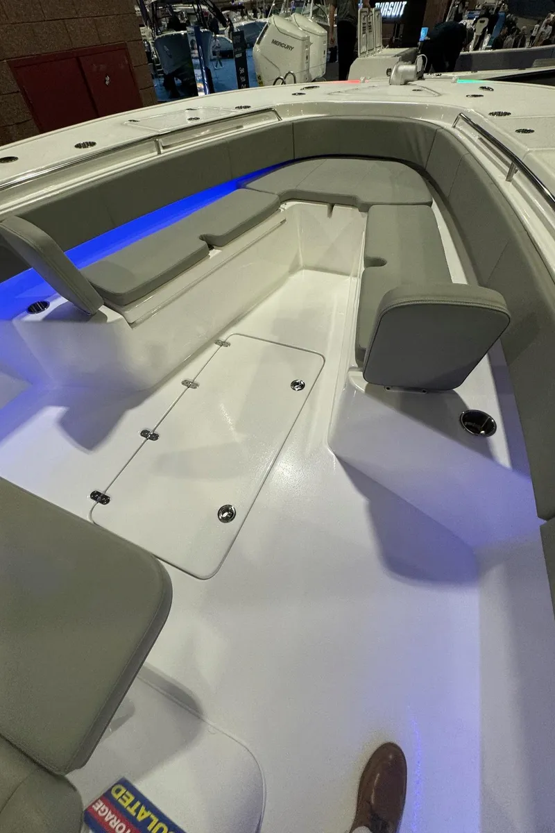 Slide: The Image of 2025 Cape Horn 36 XS boat interior with seating and blue LED lighting. - 19