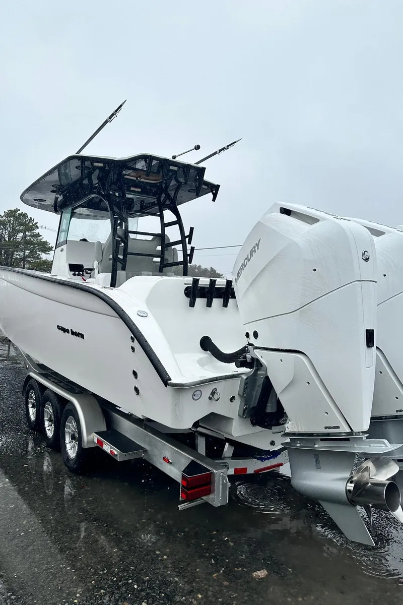 Slide: The Image of 2025 Cape Horn 36 XS boat on trailer, featuring dual outboard engines. - 6