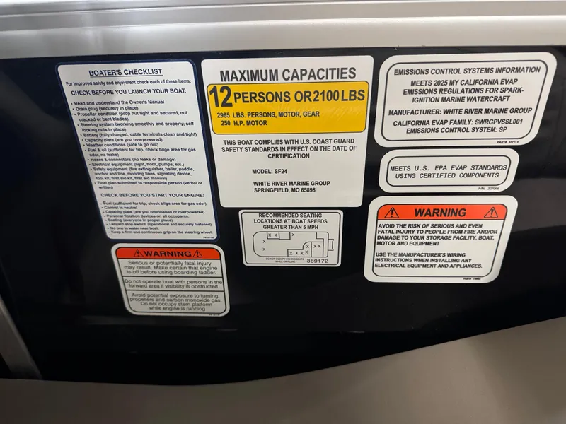 Slide: The Image of 2025 Sun Tracker Sportfish 24 XP3 capacity and safety labels, 12-person limit, compliance warnings. - 4