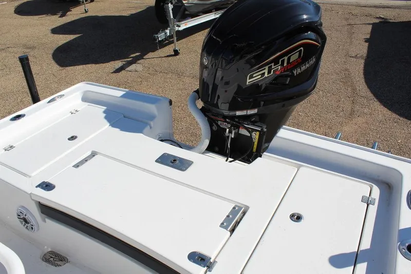 Slide: The Image of 2025 Tidewater 2410 BM boat with Yamaha outboard motor, rear deck view. - 11
