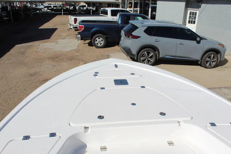 Slide: The Image of Bow view of 2025 Tidewater 2410 BM boat in a parking lot. - 18