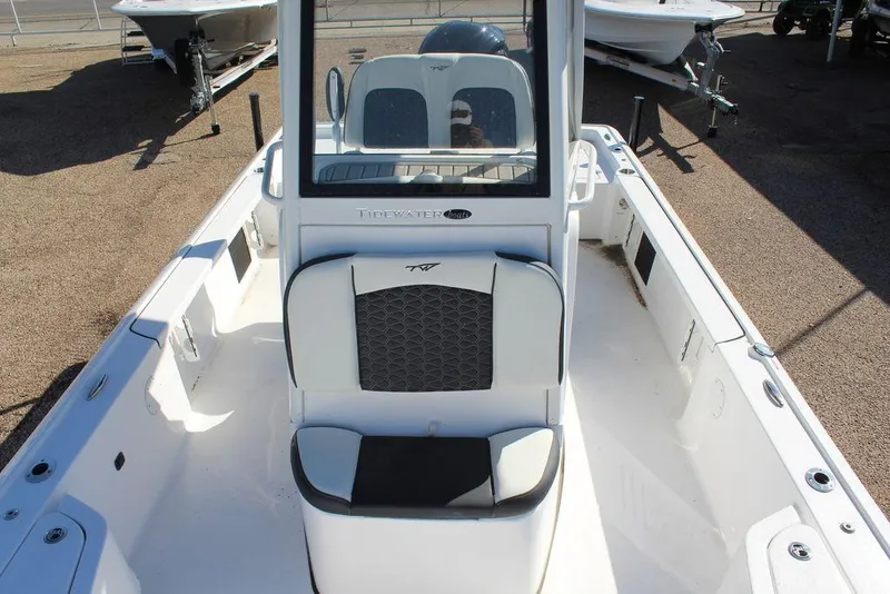 Slide: The Image of 2025 Tidewater 2410 BM boat interior with seating and console, showcasing modern design. - 19