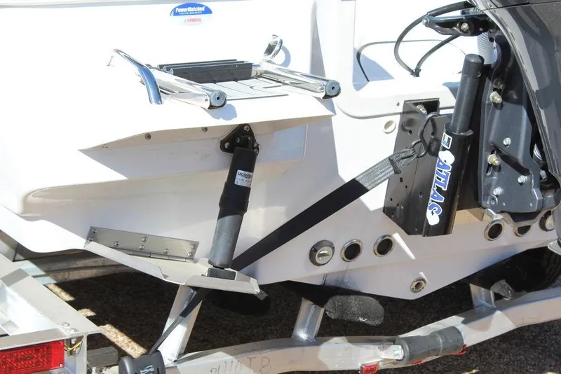 Slide: The Image of 2025 Tidewater 2410 BM boat trailer with motor support and ladder. - 5