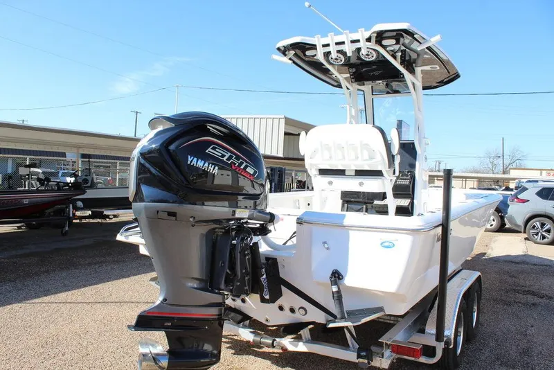 Slide: The Image of 2025 Tidewater 2410 BM boat with Yamaha engine on trailer, parked outdoors. - 7