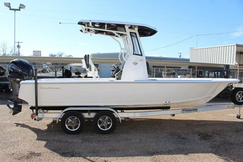 Slide: The Image of 2025 Tidewater 2410 BM boat on trailer, side view, in outdoor setting. - 8