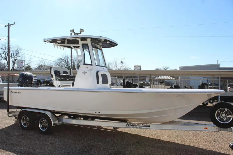 Slide: The Image of 2025 Tidewater 2410 BM boat on trailer, side view, in outdoor setting. - 9