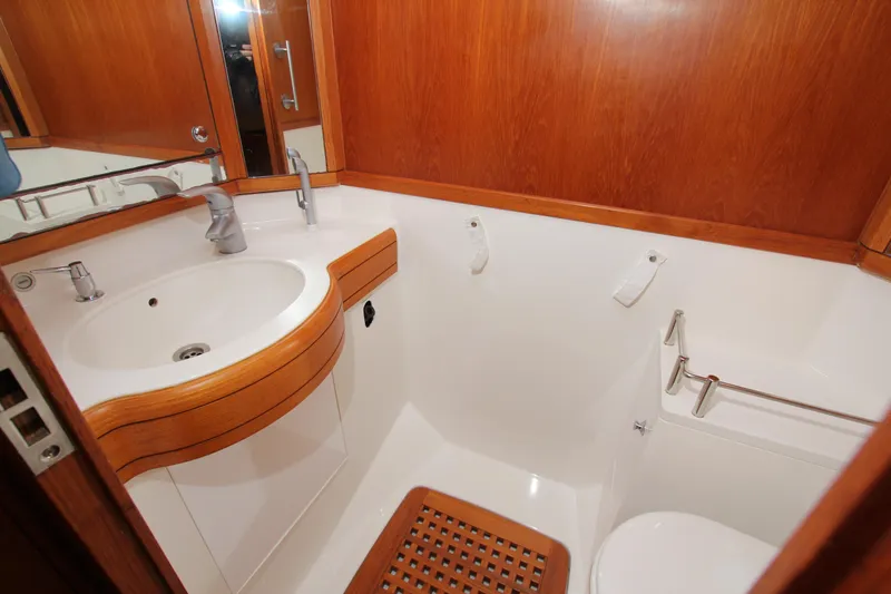 Slide: The Image of Bathroom interior of 2006 Nautor Swan 46mkIII yacht with wooden accents and modern fixtures. - 23
