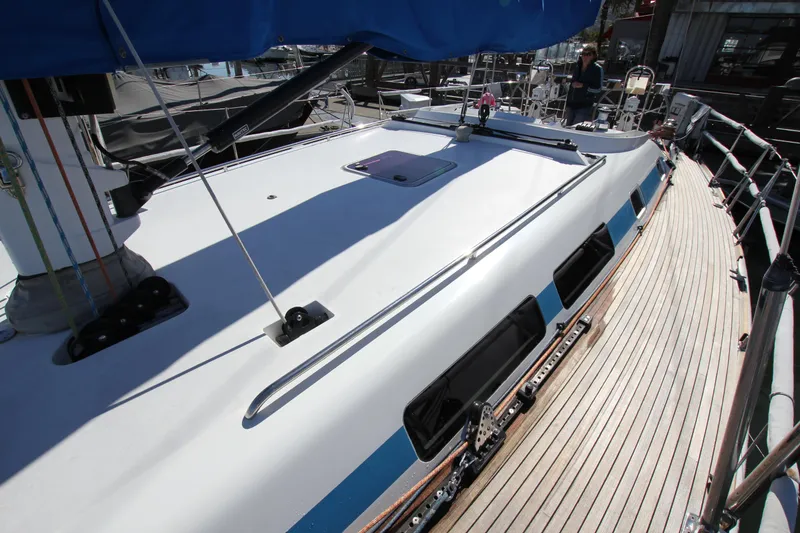 Slide: The Image of Nautor Swan 46mkIII yacht deck, 2006 model, featuring sleek design and wooden accents. - 5
