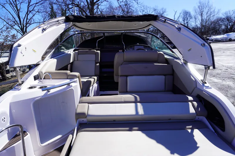 Slide: The Image of 2013 Regal 28 Express boat interior with seating and open canopy. - 4
