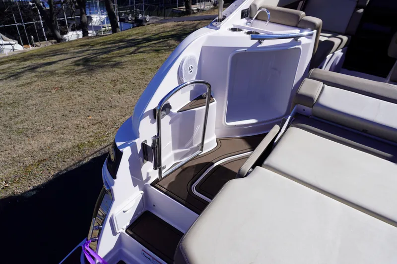 Slide: The Image of 2013 Regal 28 Express boat interior with seating and open storage compartment. - 5