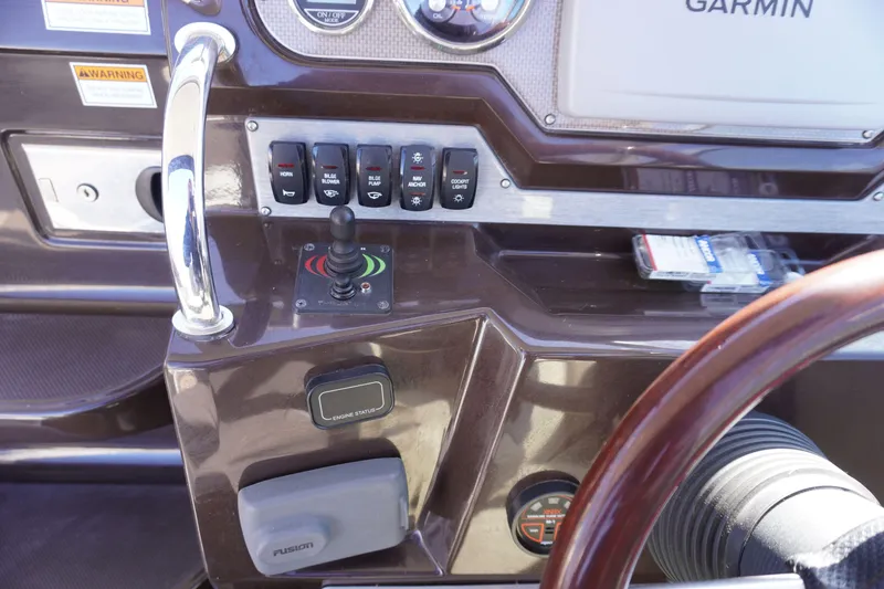 Slide: The Image of Control panel of a 2013 Regal 28 Express boat with Garmin navigation. - 8