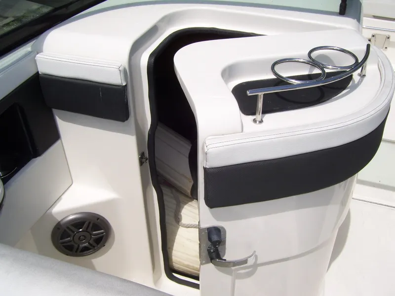 Slide: The Image of 2015 Sea Ray 240 Sundeck interior with cup holders and speaker. - 8