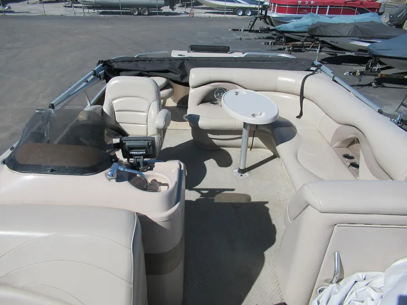 Slide: The Image of 2012 Starcraft Stardeck 226 Cruise N Fish boat interior with seating and table. - 2
