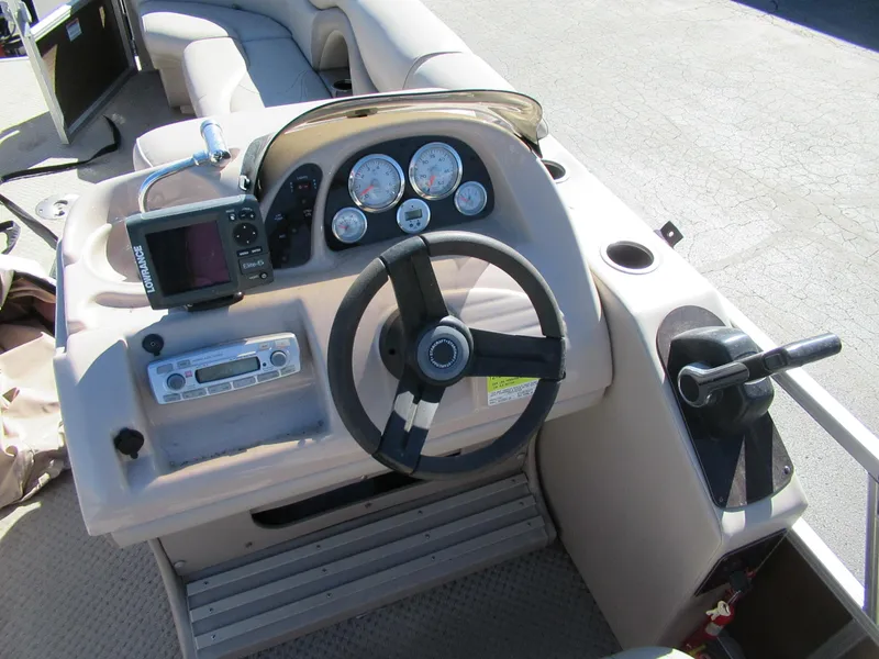 Slide: The Image of 2012 Starcraft Stardeck 226 Cruise N Fish boat dashboard with steering wheel and gauges. - 3