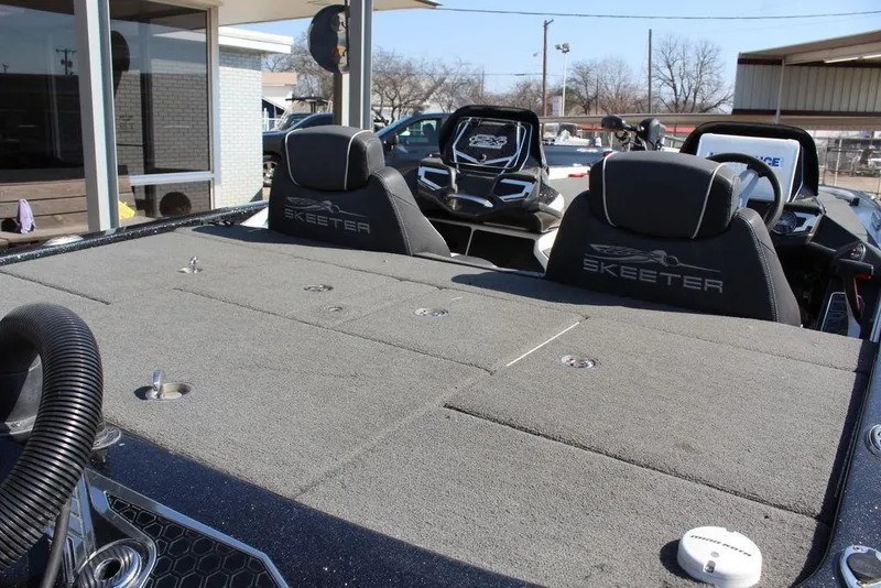Slide: The Image of 2018 Skeeter FX21 LE boat interior with branded seats and spacious deck. - 12