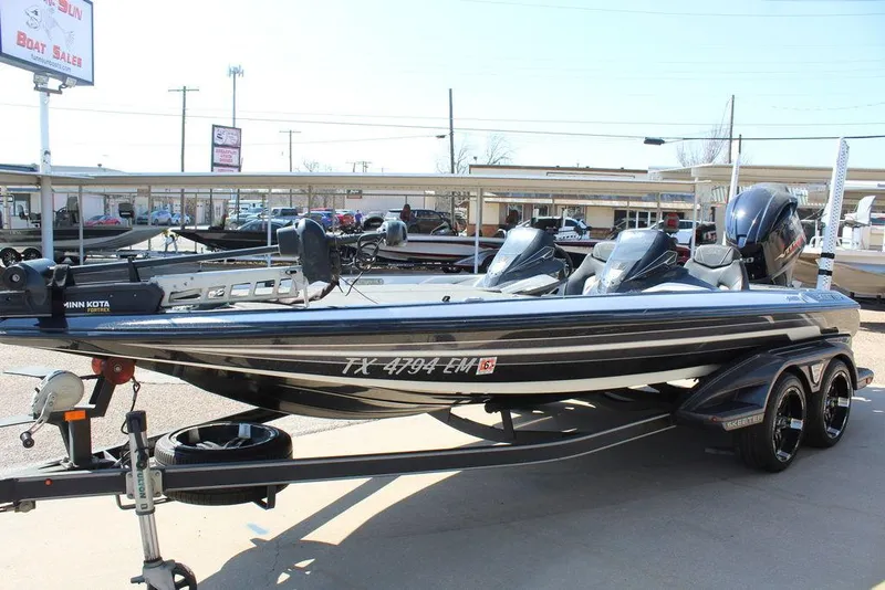 Slide: The Image of 2018 Skeeter FX21 LE bass boat on trailer in dealership lot. - 6