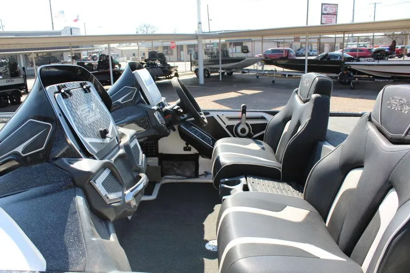 Slide: The Image of 2018 Skeeter FX21 LE boat interior with modern dashboard and seating. - 9