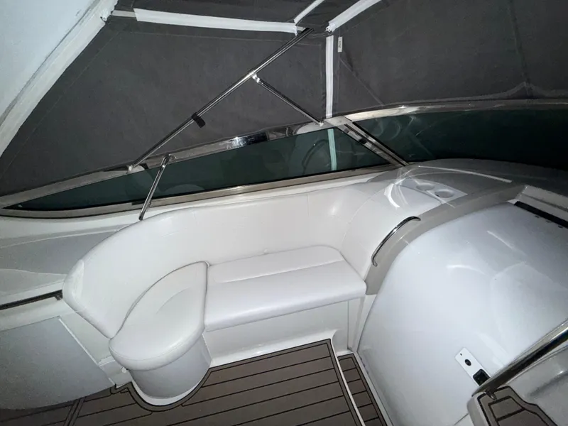 Slide: The Image of Interior of a 2003 Formula 400ss boat with white seating and sleek design. - 10
