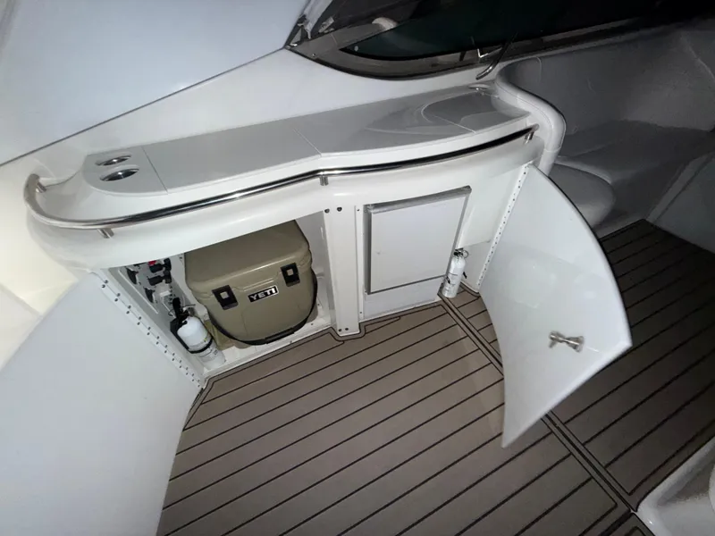Slide: The Image of 2003 Formula 400ss boat interior with storage compartment and Yeti cooler. - 13