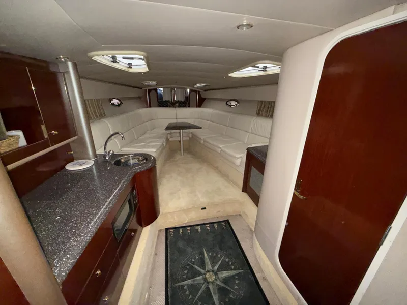 Slide: The Image of Luxurious interior of a 2003 Formula 400ss yacht with plush seating and kitchenette. - 17