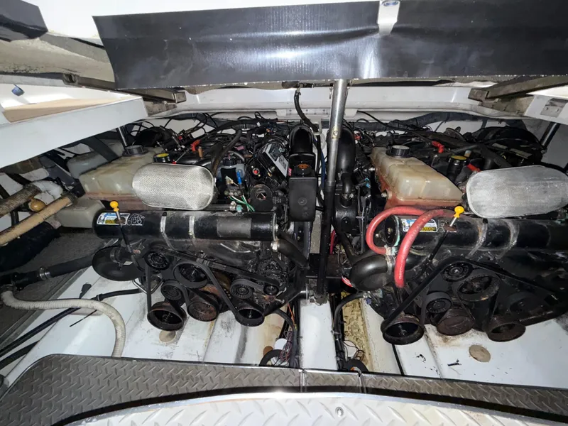 Slide: The Image of Engine compartment of a 2003 Formula 400ss boat, showcasing dual engines and components. - 26
