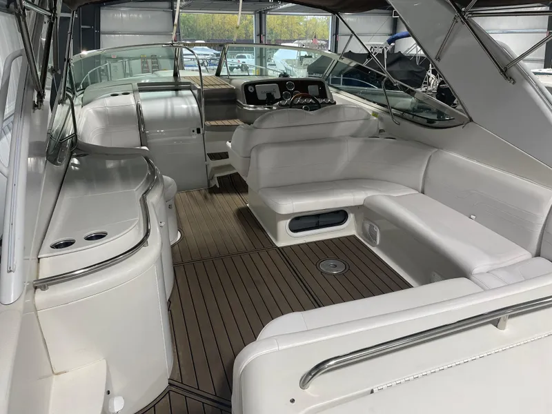 Slide: The Image of 2003 Formula 400ss yacht interior with white seating and wood flooring. - 6