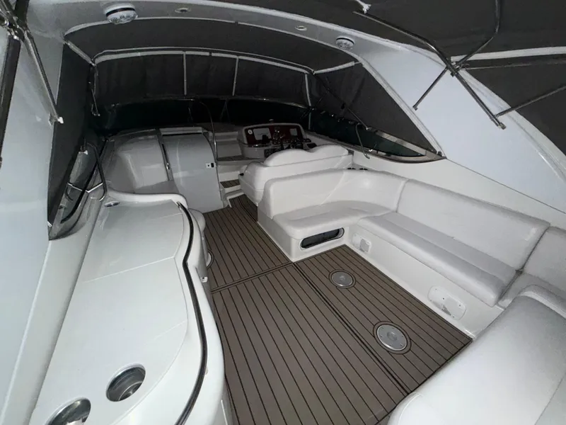 Slide: The Image of 2003 Formula 400ss boat interior with white seating and wood-style flooring. - 7