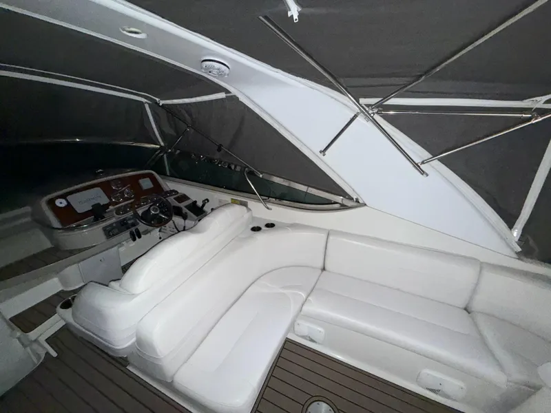 Slide: The Image of 2003 Formula 400ss boat interior with white seating and helm. - 9