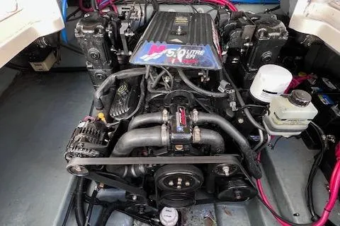 Slide: The Image of Engine of a 2000 Sea Ray 245 Weekender boat, showcasing a 5.0-litre V8 motor. - 17