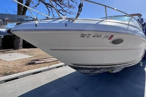 Slide: The Image of 2000 Sea Ray 245 Weekender boat on trailer, side view, outdoors. - 6