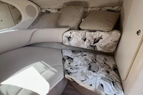 Slide: The Image of Interior cabin of 2000 Sea Ray 245 Weekender with cushions and patterned upholstery. - 9
