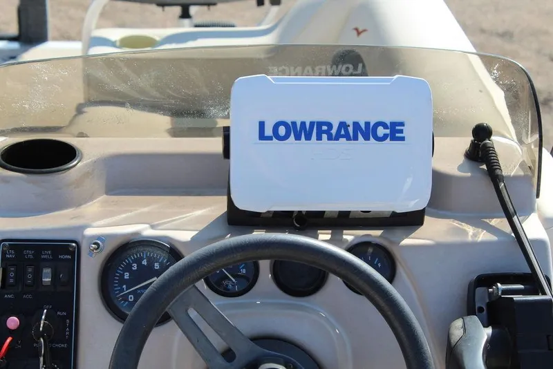 Slide: The Image of Dashboard of a 1997 Monark Pontoon boat with Lowrance navigation system. - 18